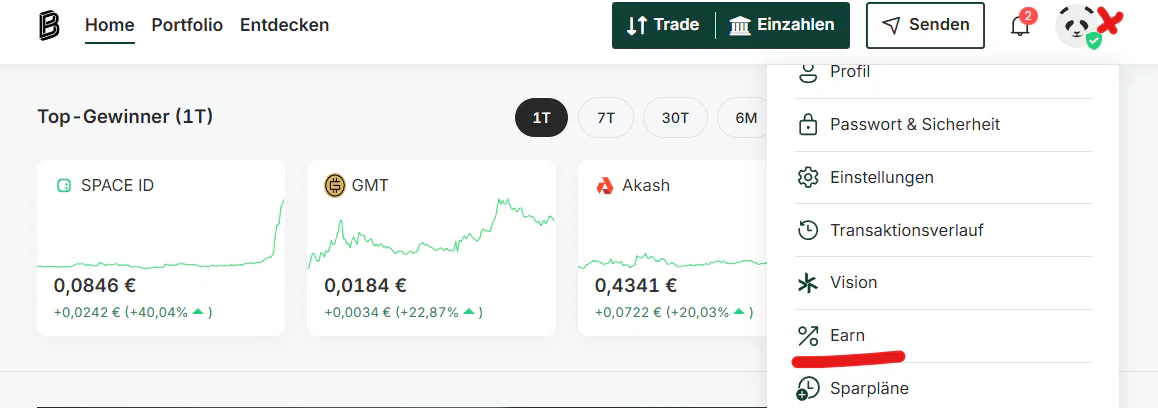 Bitpanda Dashboard: Übersicht der Top-Gewinner im Tagesverlauf mit Kurskarten (SPACE ID, GMT, Akash) sowie geöffnetes Profilmenü mit Optionen wie Profil, Sicherheit, Transaktionsverlauf und Earn-Bereich.